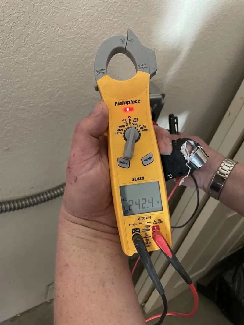 Voltage testing with clamp meter during Electrical Installation Services in Tangerine